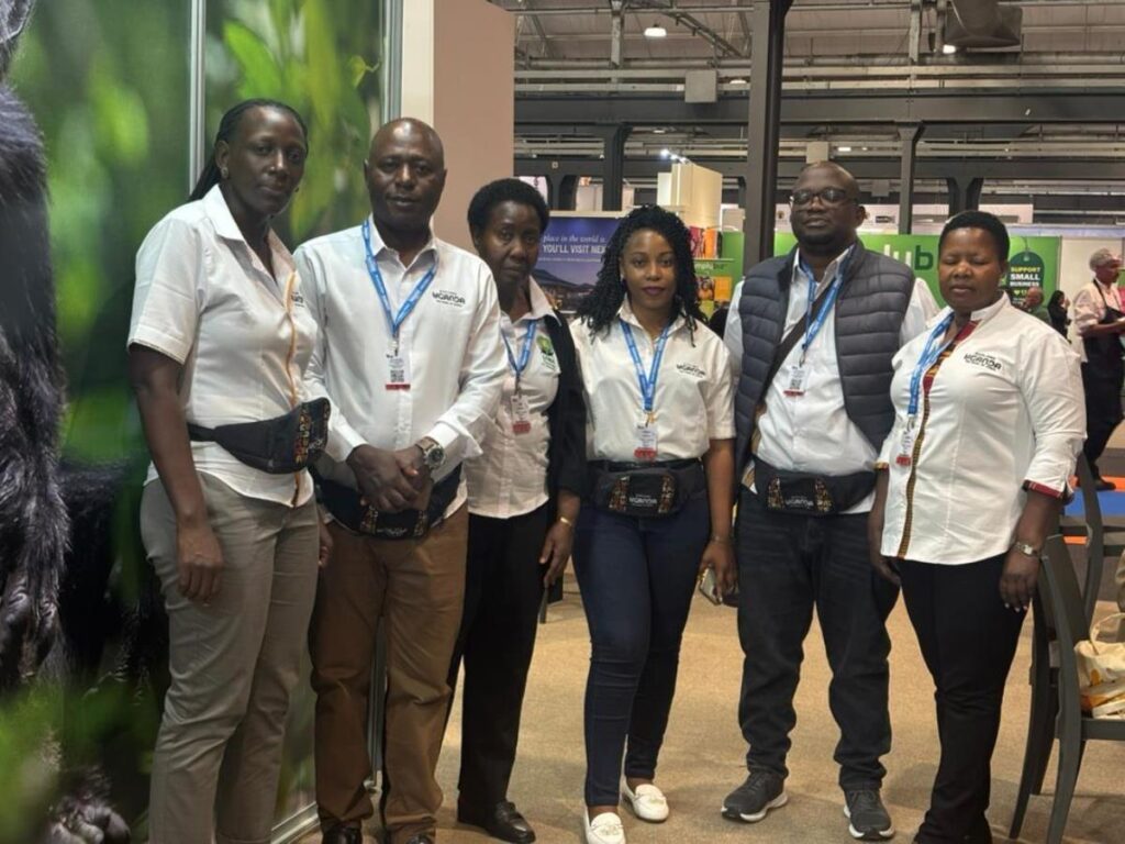 Members of the Ugandan delegation pose proudly at their exhibition booth during Africa’s Travel Indaba 2026, championing the country's sustainable tourism and wildlife heritage.