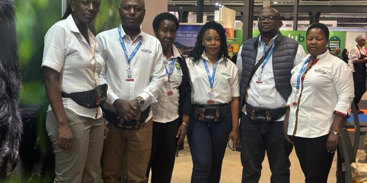 Members of the Ugandan delegation pose proudly at their exhibition booth during Africa’s Travel Indaba 2026, championing the country's sustainable tourism and wildlife heritage.