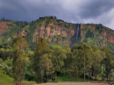 Stunning view of the majestic Wanale Ridge and its iconic waterfall in Mbale, Eastern Uganda. Captured from the ridge, this breathtaking landscape showcases the natural beauty that makes Uganda the Pearl of Africa