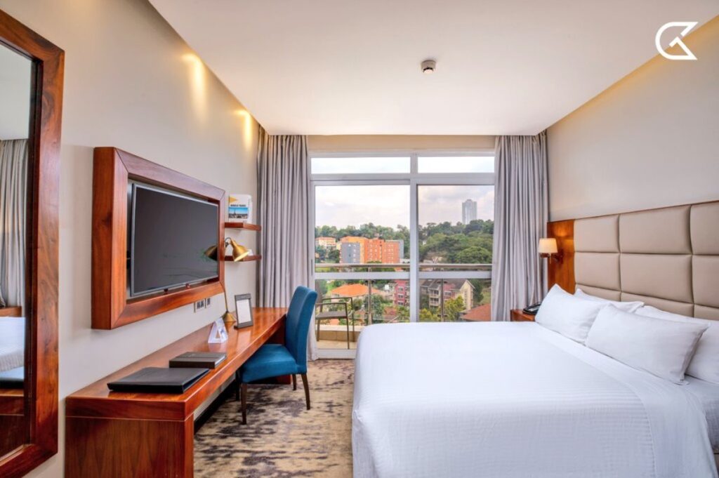 Spacious deluxe room at Golden Tulip Kampala overlooking the scenic Kampala hills, one of the highlights praised by guests in the TripAdvisor Travellers’ Choice Award 2026