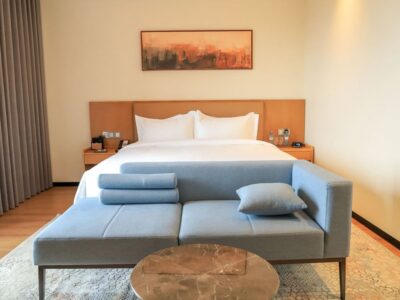 Stylish and comfortable guest room at the new Bamus Sarovar Portico Kampala. The hotel features contemporary design, premium bedding, and a relaxing seating area, perfect for both leisure travelers and business guests. Stylish and comfortable guest room at the new Bamus Sarovar Portico Kampala. The hotel features contemporary design, premium bedding, and a relaxing seating area, perfect for both leisure travelers and business guests.
