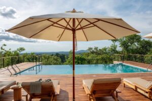 Breathtaking infinity pool at Pabidi Lodge Budongo, offering panoramic views over Uganda’s ancient Budongo Forest