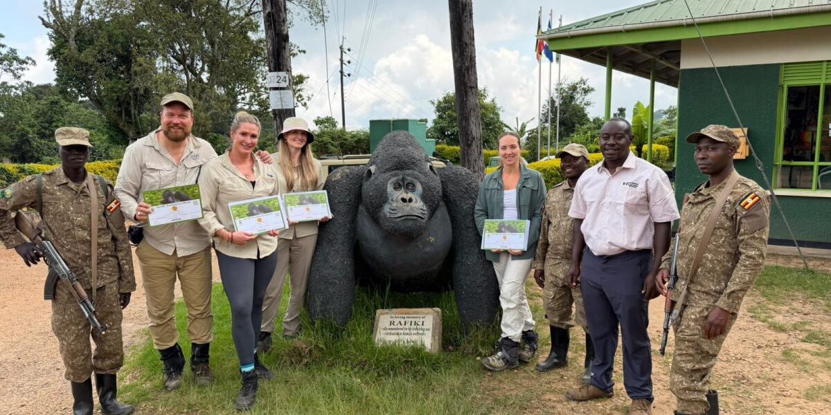 Australian tourism professionals and media delegates pose with certificates after completing their gorilla trekking experience during the 10-day Familiarization Tour in Uganda