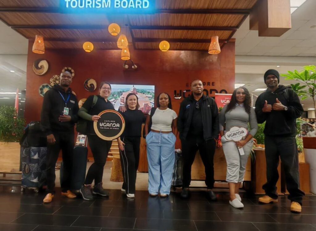 Southern African travel agents and buyers proudly pose with 'Explore Uganda' branding upon arrival in Uganda for the pre-Pearl of Africa Tourism Expo 2026 familiarization trip