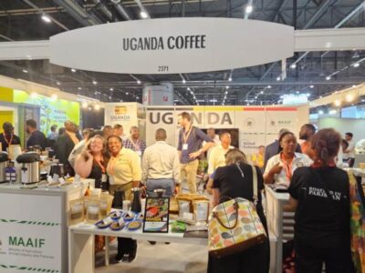 Visitors and coffee professionals at the vibrant Uganda Coffee pavilion at the World of Coffee Brussels event 2026