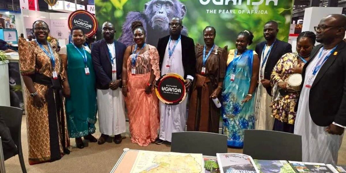 The Ugandan team standing tall behind our iconic chimpanzee banner, inviting the world to discover the beauty of the Pearl of Africa
