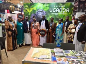 The Ugandan team standing tall behind our iconic chimpanzee banner, inviting the world to discover the beauty of the Pearl of Africa