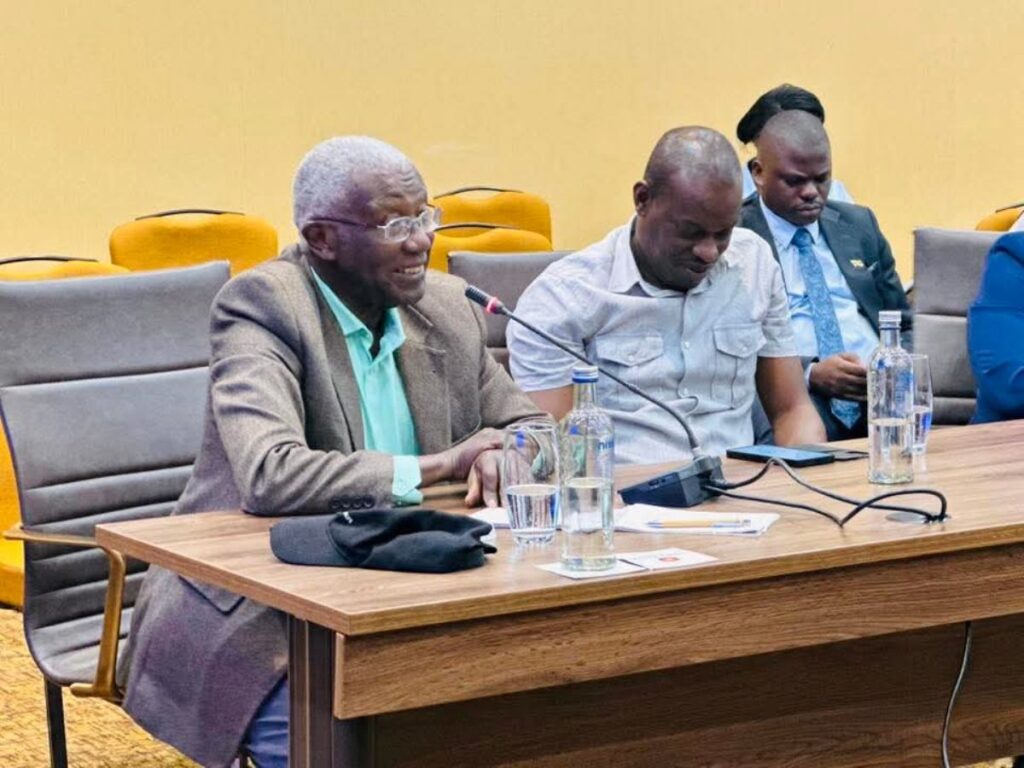 Hon. Col. (Rtd) Tom R. Butime, Minister for Tourism, Wildlife and Antiquities (left), engages during the high-level preparations review for the Pearl of Africa Tourism Expo 2026