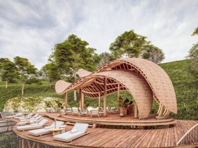 Relaxation area at Erebero Hills Lodge featuring a sculptural wooden deck with sun loungers and shaded pavilion, perfectly positioned to soak in the misty beauty of Uganda’s Bwindi Impenetrable Forest