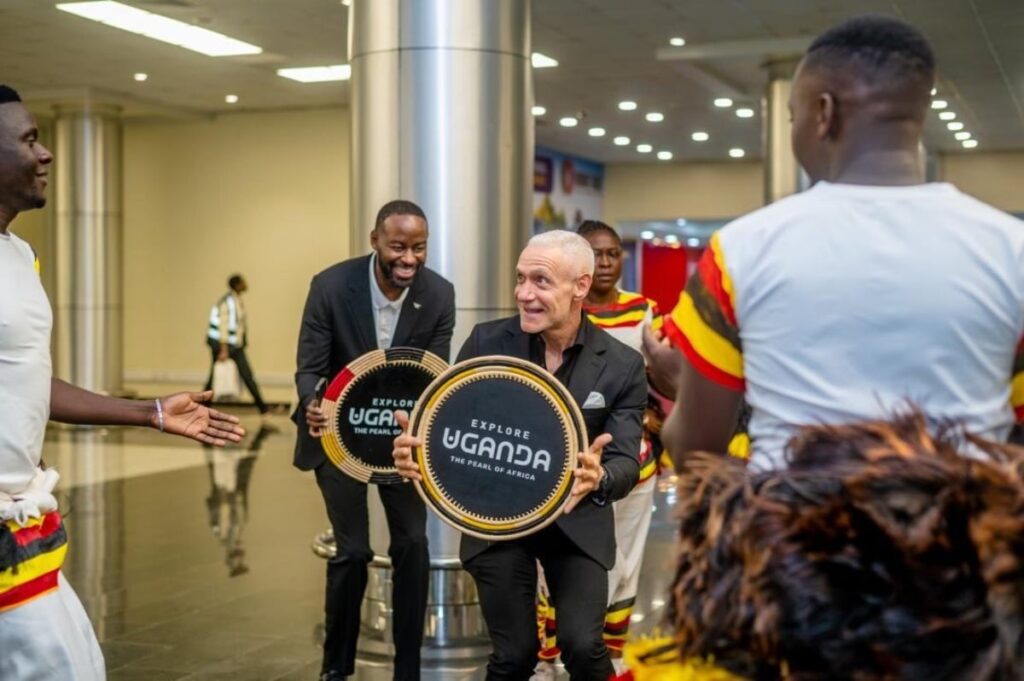 Roc Nation delegation members receive symbolic 'Explore Uganda – The Pearl of Africa' drums as part of the warm traditional welcome at Entebbe International Airport ahead of AFCON 2027 preparations