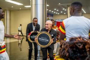 Roc Nation delegation members receive symbolic 'Explore Uganda – The Pearl of Africa' drums as part of the warm traditional welcome at Entebbe International Airport ahead of AFCON 2027 preparations
