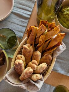 Delicious freshly baked bread selection served at Namoni Lodge, showcasing the warm hospitality and culinary offerings awaiting guests in Kidepo Valley