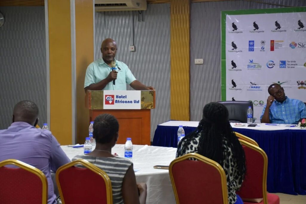 A speaker addresses delegates during Nature Uganda’s Annual General Meeting at Hotel Africana, highlighting key conservation achievements and future priorities for Uganda’s biodiversity