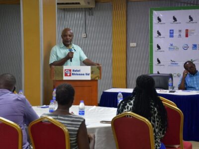 A speaker addresses delegates during Nature Uganda’s Annual General Meeting at Hotel Africana, highlighting key conservation achievements and future priorities for Uganda’s biodiversity