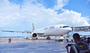 A Uganda Airlines aircraft stands on the tarmac at Entebbe International Airport, showcasing the national carrier’s distinctive “Pearl of Africa” livery