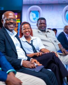 MTN MoMo Uganda Managing Director Phrase Lubega (left) and Chief Product Officer Jemima Kariuki-Njuguna share a light moment with a guest during the Travel by MoMo launch event
