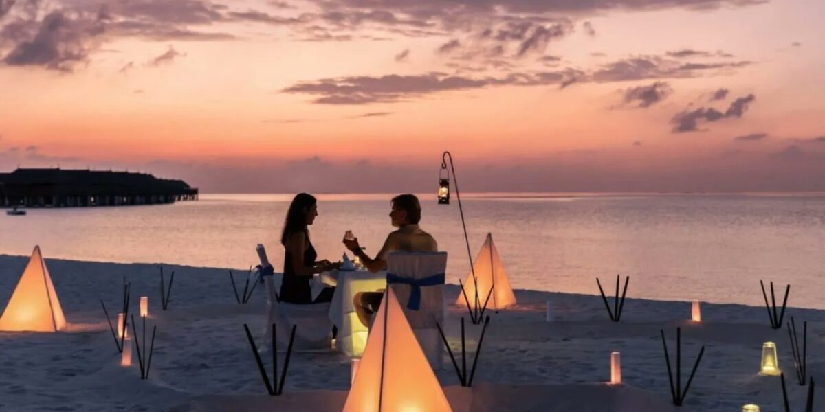 A couple captured during their honeymoon dinner