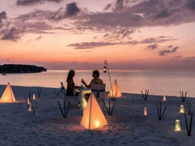 A couple captured during their honeymoon dinner