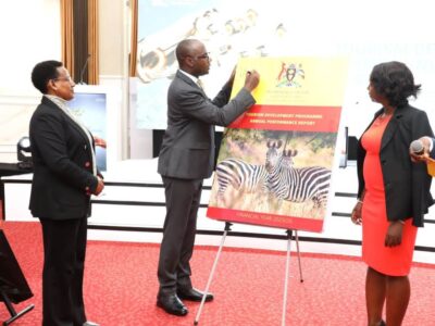 Finance Minister Hon. Henry Musasizi signs the Tourism Development Programme Annual Performance Report for Financial Year 2025/26 during the official unveiling at the 4th Annual Tourism Development Programme Review Conference, Imperial Royale Hotel, Kampala Finance Minister Hon. Henry Musasizi signs the Tourism Development Programme Annual Performance Report for Financial Year 2025/26 during the official unveiling at the 4th Annual Tourism Development Programme Review Conference, Imperial Royale Hotel, Kampala