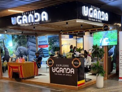 Uganda’s professional exhibition booth at the 12th ExpoBéton RDC in Kinshasa highlights the country’s rich biodiversity through striking wildlife photography while the Embassy of Uganda banner underscores official support for bilateral economic and tourism ties