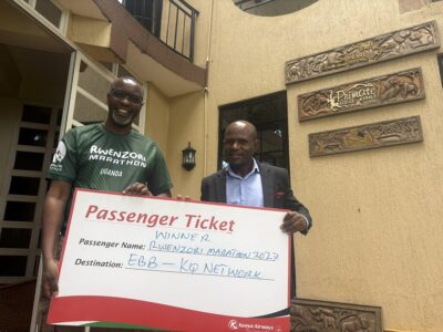 Amos Wekesa and Kenya Airways Country Manager Felix Mwangangi pose with the ceremonial Kenya Airways passenger ticket awarded to the winner of the Rwenzori Marathon 2027 Amos Wekesa and Kenya Airways Country Manager Felix Mwangangi pose with the ceremonial Kenya Airways passenger ticket awarded to the winner of the Rwenzori Marathon 2027