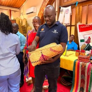 A participant inspects a handcrafted basket produced by women from an indigenous minority group during the cultural enterprises exhibition