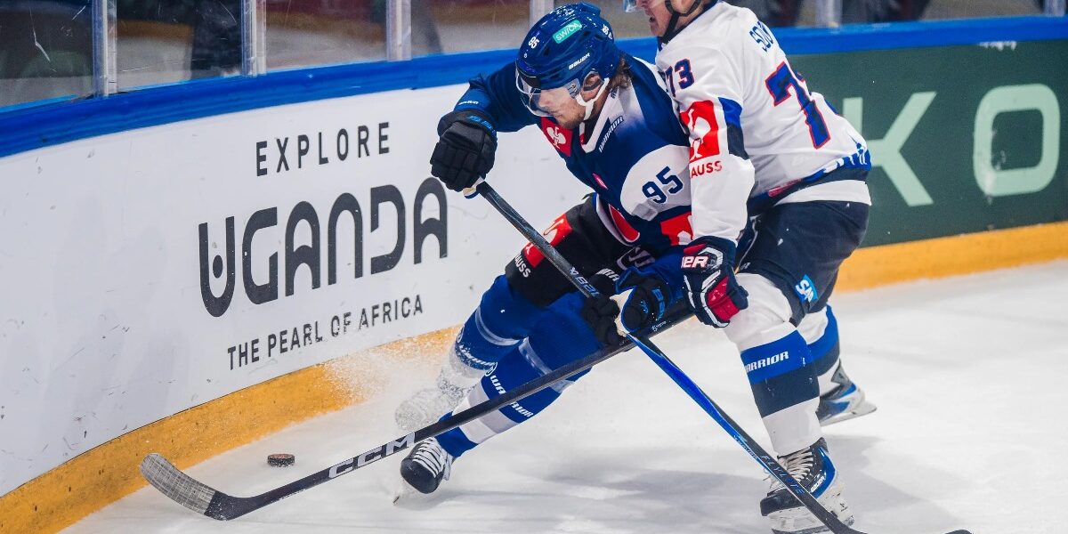 Champions Hockey League action unfolds against the backdrop of Uganda Tourism Board branding, highlighting the one-year strategic partnership designed to introduce Swiss ice hockey audiences to the Pearl of Africa