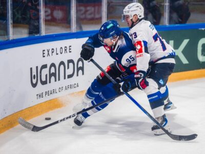 Champions Hockey League action unfolds against the backdrop of Uganda Tourism Board branding, highlighting the one-year strategic partnership designed to introduce Swiss ice hockey audiences to the Pearl of Africa Champions Hockey League action unfolds against the backdrop of Uganda Tourism Board branding, highlighting the one-year strategic partnership designed to introduce Swiss ice hockey audiences to the Pearl of Africa